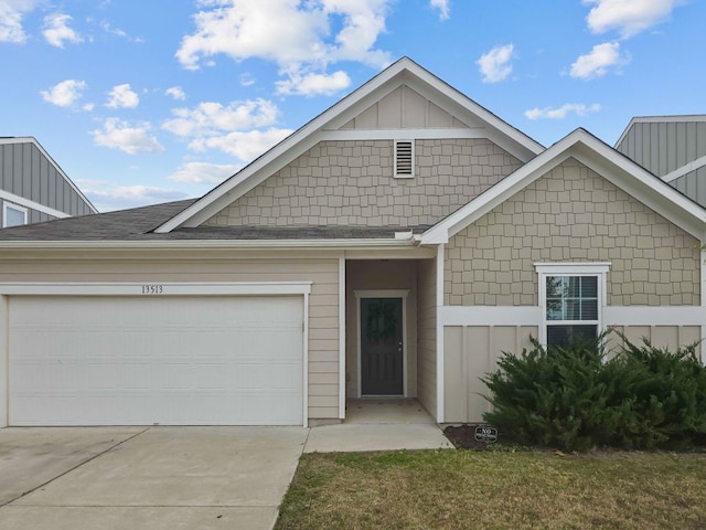 view of front of property featuring board and batten siding, concrete driveway, and a garage