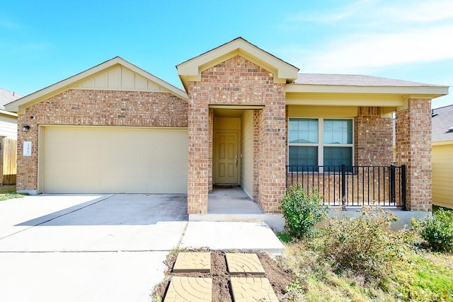 single story home with board and batten siding, brick siding, driveway, and an attached garage