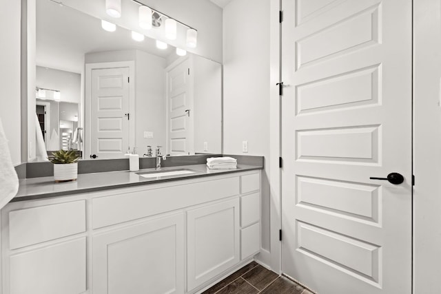 bathroom with wood tiled floor and vanity