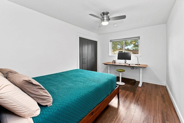 bedroom with a ceiling fan, a closet, baseboards, and wood finished floors