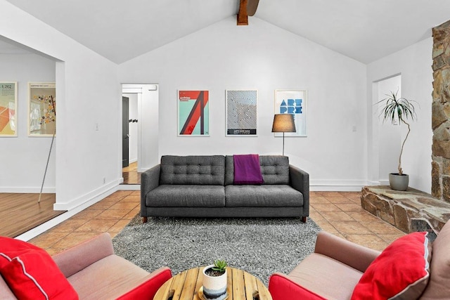 living room with lofted ceiling with beams, baseboards, and tile patterned floors