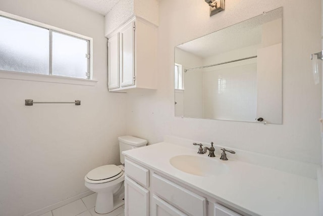 full bath featuring vanity, toilet, and tile patterned floors