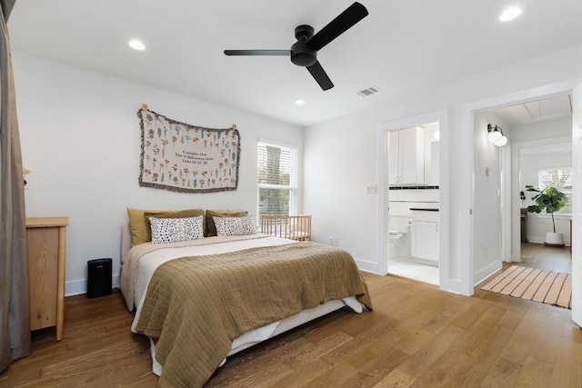 bedroom featuring attic access, recessed lighting, and light wood-style flooring