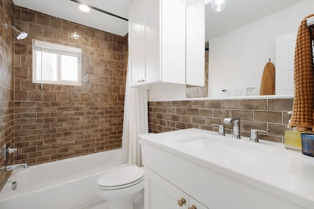 full bathroom with shower / tub combo with curtain, tile walls, tasteful backsplash, toilet, and vanity