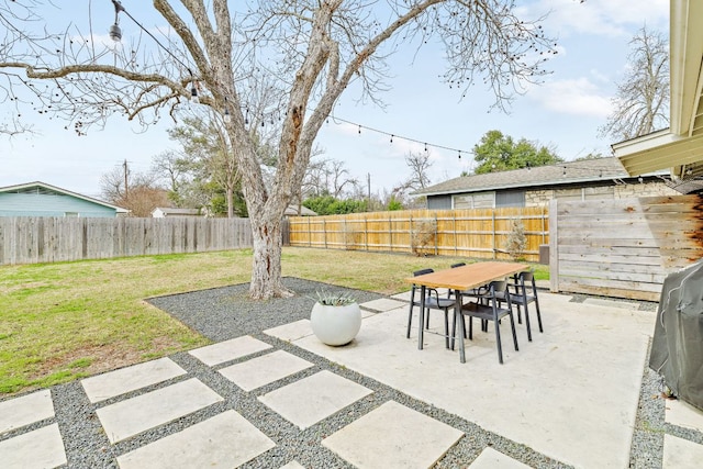 view of patio featuring outdoor dining area and a fenced backyard