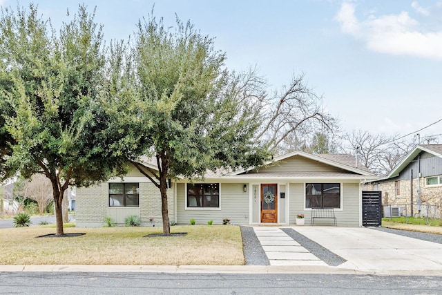 ranch-style home with central AC and a front yard