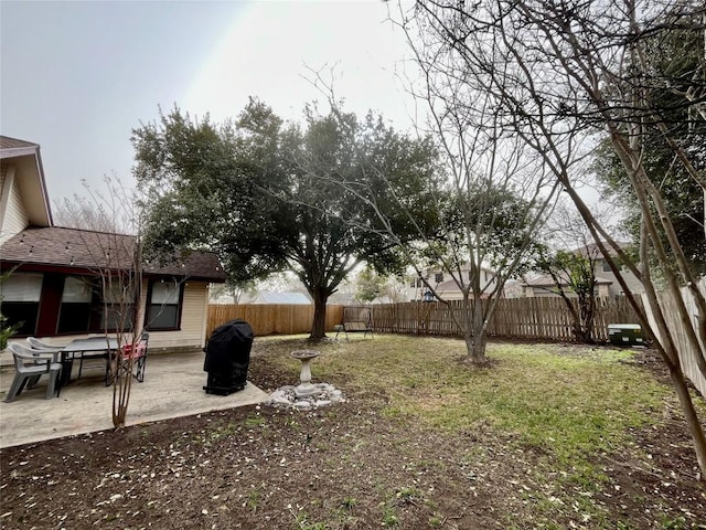 view of yard with a fenced backyard and a patio