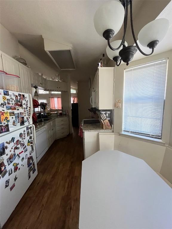 kitchen with dark wood-style floors and white appliances