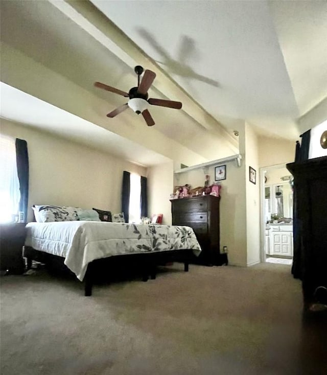 carpeted bedroom with ceiling fan and vaulted ceiling