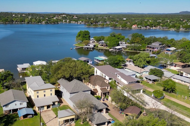 birds eye view of property featuring a water view and a residential view