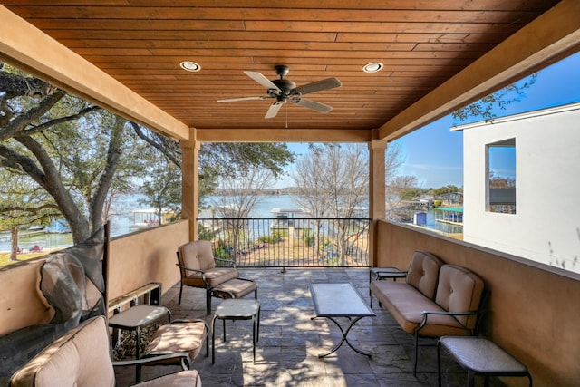 view of patio / terrace with ceiling fan and an outdoor living space