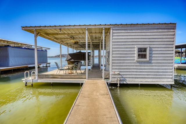 view of dock featuring a water view and boat lift