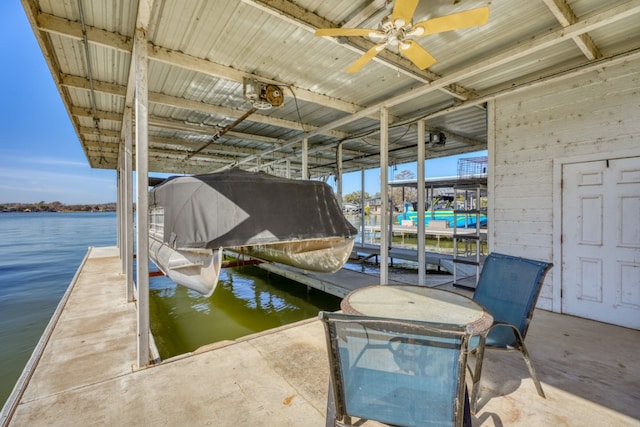 view of dock with a water view and boat lift