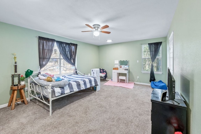 bedroom with carpet, ceiling fan, and baseboards