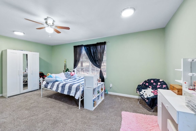 carpeted bedroom featuring ceiling fan and baseboards