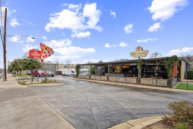 view of road with curbs and sidewalks