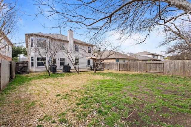 view of yard with a fenced backyard and a patio