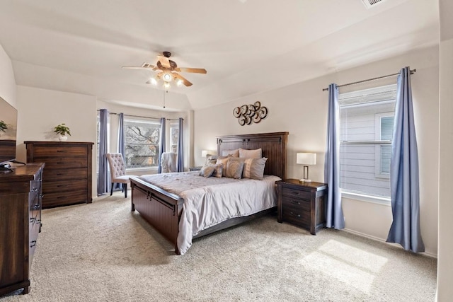 bedroom featuring a ceiling fan and light colored carpet