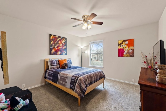 bedroom with ceiling fan, carpet floors, and baseboards