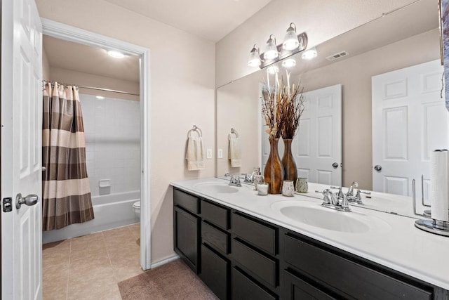 bathroom featuring double vanity, tile patterned flooring, shower / bathtub combination with curtain, and a sink