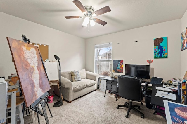 office area with carpet and a ceiling fan