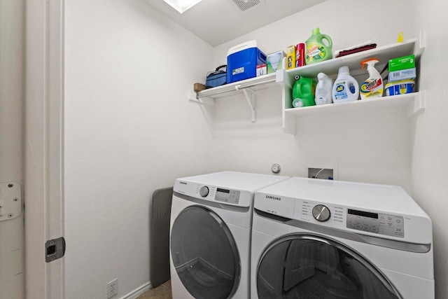 laundry area with laundry area and washer and dryer