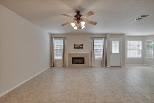 525 Golden Creek Dr, Round Rock, TX 78665 - unfurnished living room with a ceiling fan, a tile fireplace, baseboards, and light tile patterned flooring