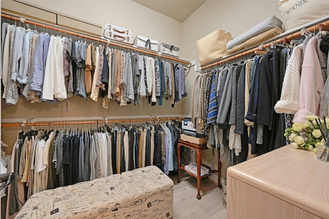 walk in closet featuring light wood finished floors