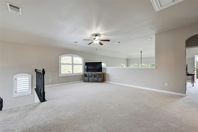 unfurnished living room with carpet, visible vents, and baseboards