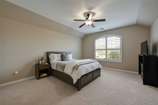 bedroom featuring baseboards, visible vents, light colored carpet, ceiling fan, and vaulted ceiling