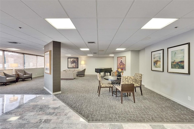 40 N Interstate 35 Hwy Unit 2D4, Austin, TX 78701 - dining area with carpet, baseboards, and a paneled ceiling
