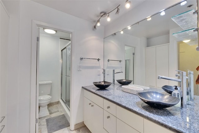 40 N Interstate 35 Hwy Unit 2D4, Austin, TX 78701 - full bath with double vanity, a stall shower, a sink, and toilet