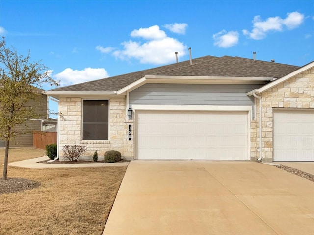 ranch-style house with an attached garage, stone siding, and a shingled roof