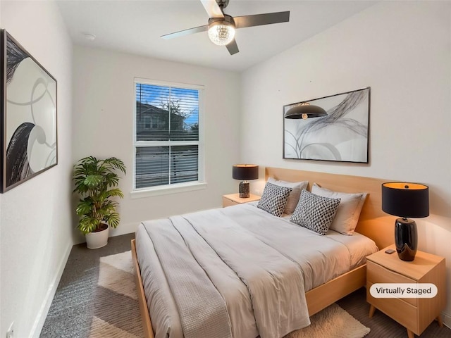 bedroom featuring a ceiling fan, carpet flooring, and baseboards