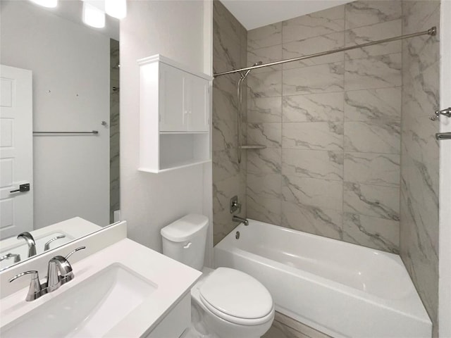 bathroom featuring tub / shower combination, vanity, and toilet