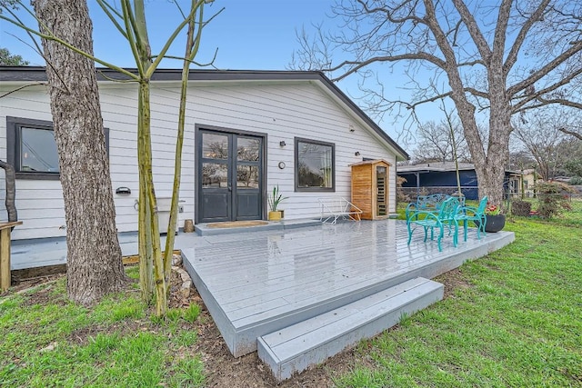 wooden terrace with fence and a yard