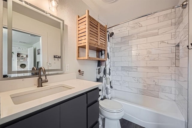 full bathroom with shower / tub combo, vanity, and toilet