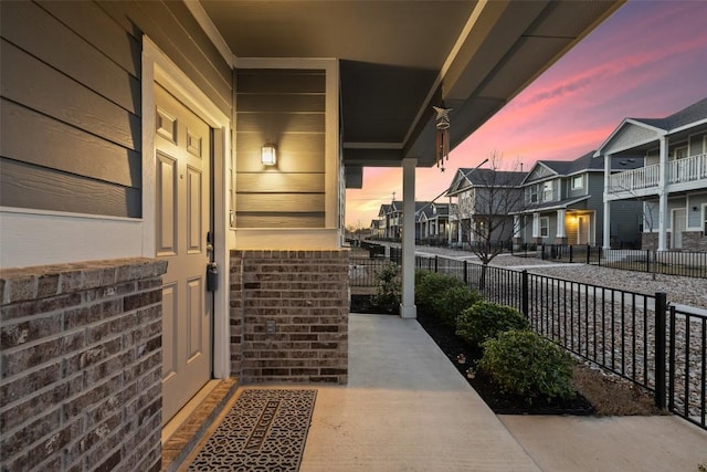 exterior space with fence and a residential view