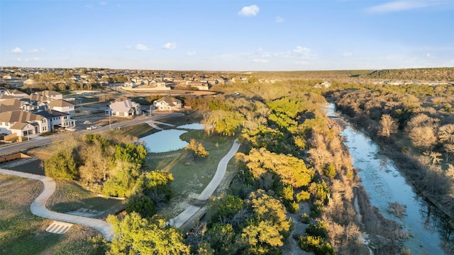 bird's eye view featuring a residential view and a water view