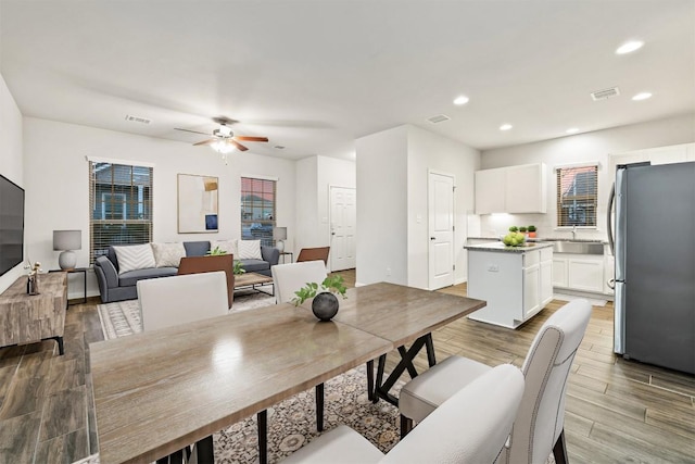 dining room with recessed lighting, visible vents, wood finished floors, and ceiling fan