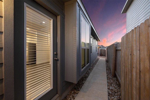 property exterior at dusk with fence