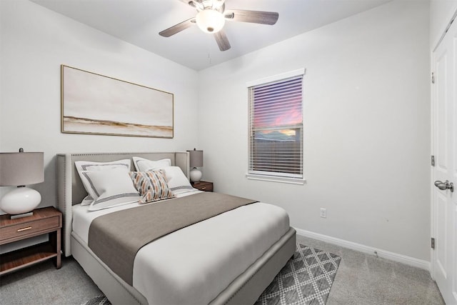 bedroom featuring baseboards, a ceiling fan, and carpet flooring