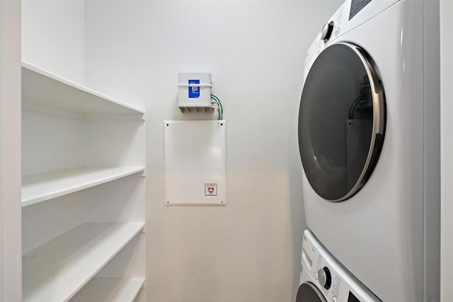 laundry area featuring laundry area and stacked washing maching and dryer