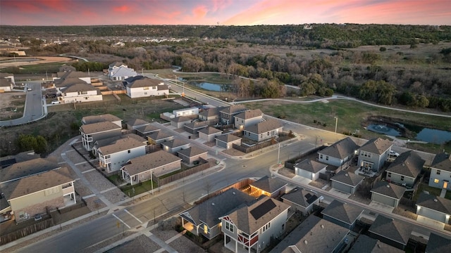 bird's eye view featuring a residential view and a water view