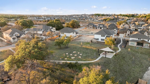 birds eye view of property with a residential view