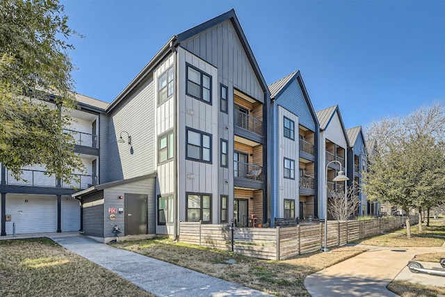 view of front facade featuring a fenced front yard and board and batten siding