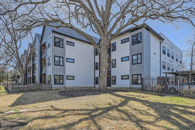 view of building exterior featuring fence