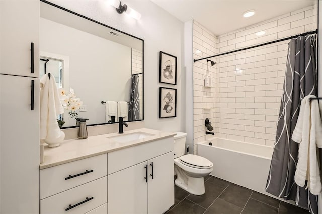 bathroom with toilet, shower / tub combo, visible vents, vanity, and tile patterned floors