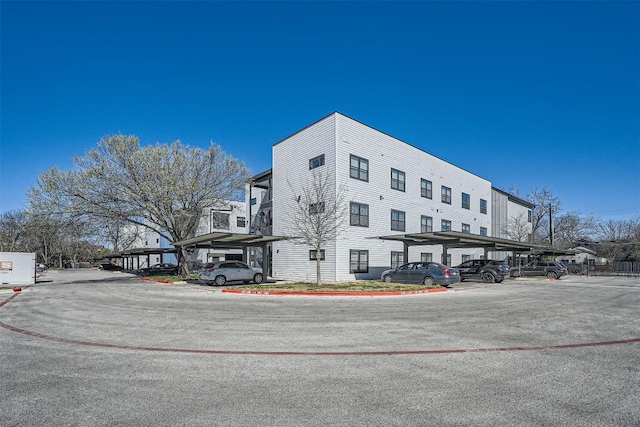 view of property featuring covered parking