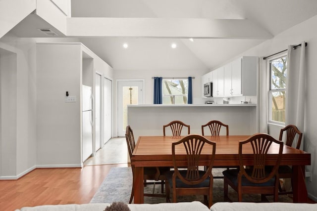 dining room with vaulted ceiling with beams, light wood-type flooring, visible vents, and recessed lighting